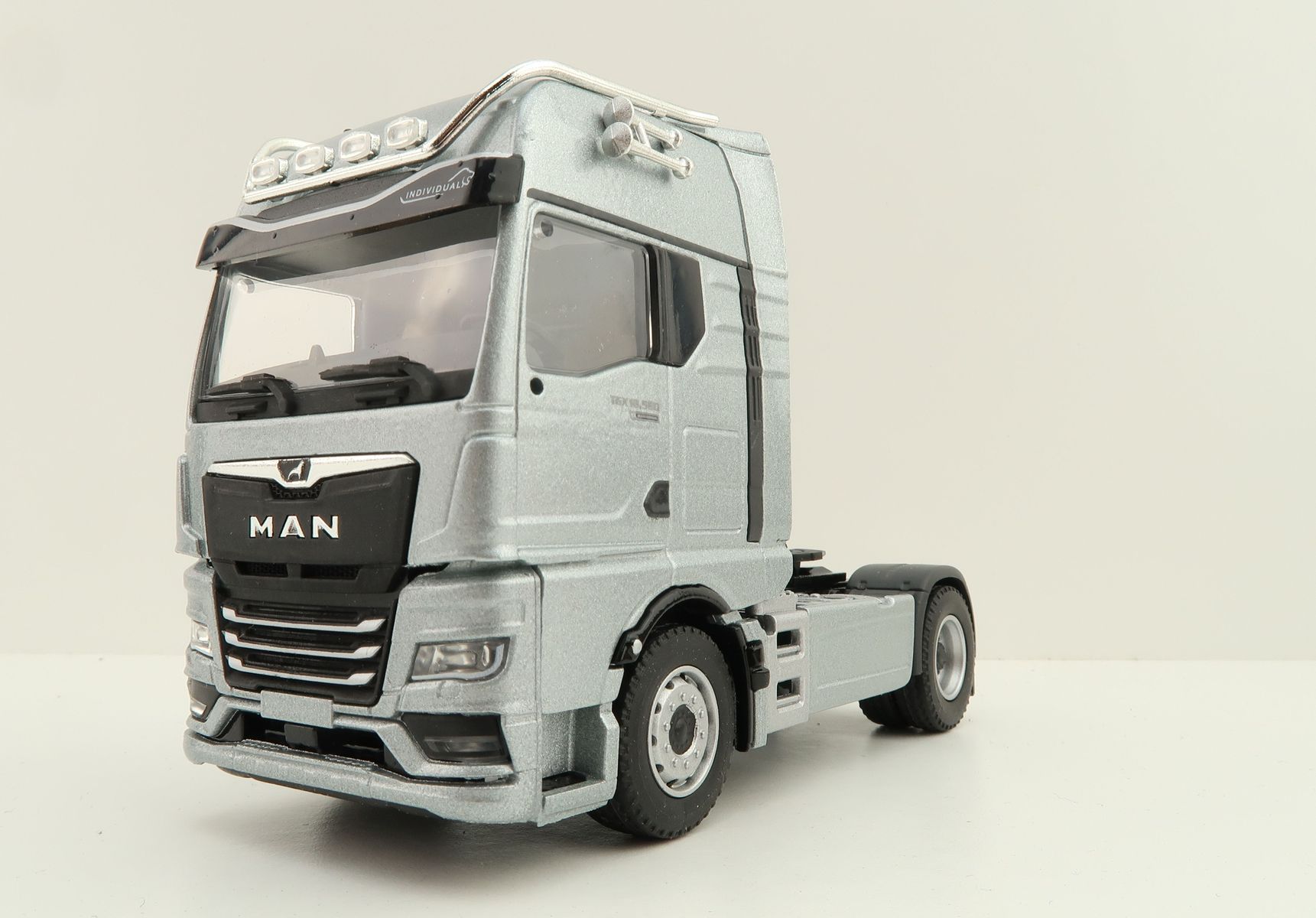 Product Image - Conrad 80000/10 MAN TGX GX 4x2 Prime Mover Truck Silver - Scale 1:50