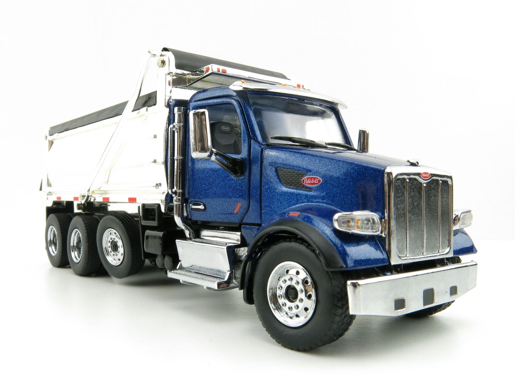 Product Image - Diecast Masters 71073 - Peterbilt 567 Dump Truck Blue with Chromed Dump Body  - Scale 1:50