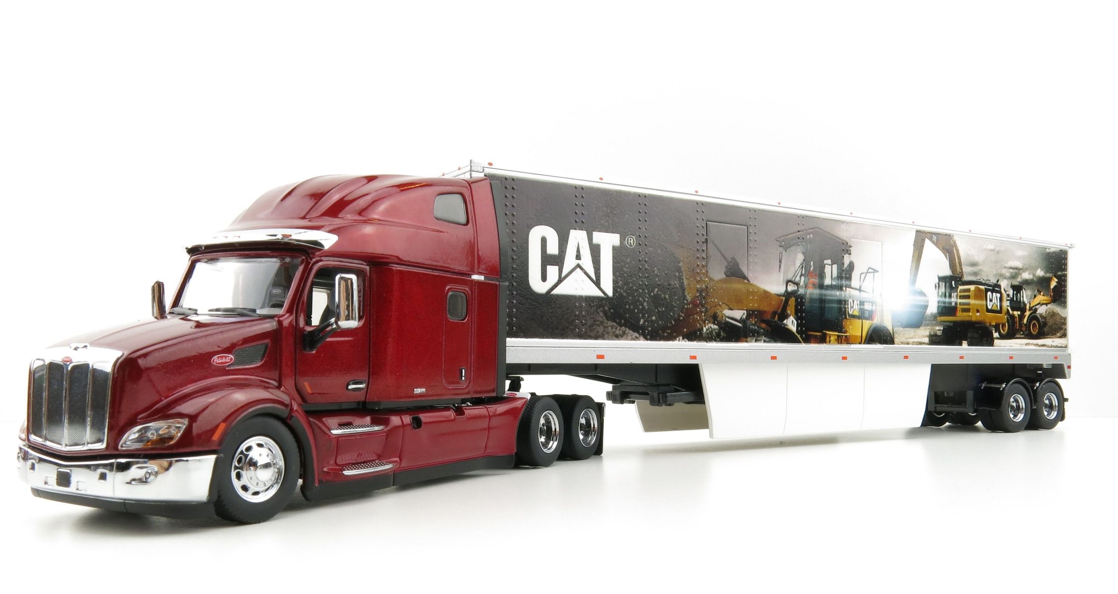 Diecast Masters 85665 Peterbilt 579 Truck with CAT Mural Trailer 1:50