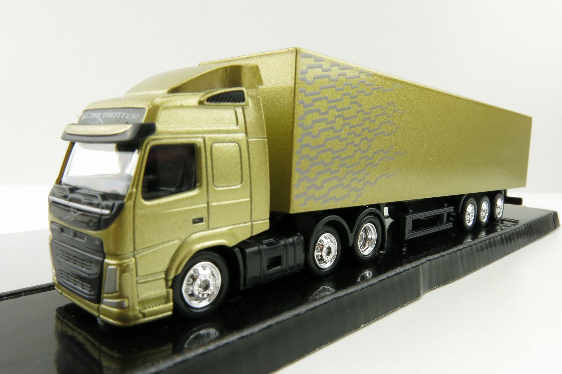 Product Image - Motorart 300042 - Volvo FM 6x2 truck with Box Trailer Gold - Scale 1:87